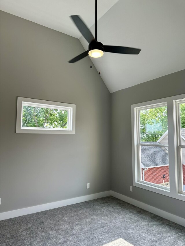 unfurnished room featuring ceiling fan, carpet, and high vaulted ceiling