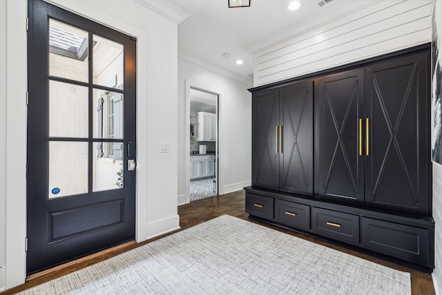 mudroom featuring crown molding and dark hardwood / wood-style flooring