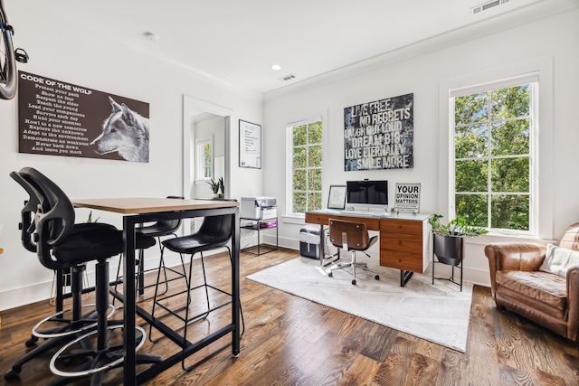 office space featuring wood-type flooring and ornamental molding