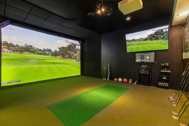 game room with carpet and golf simulator