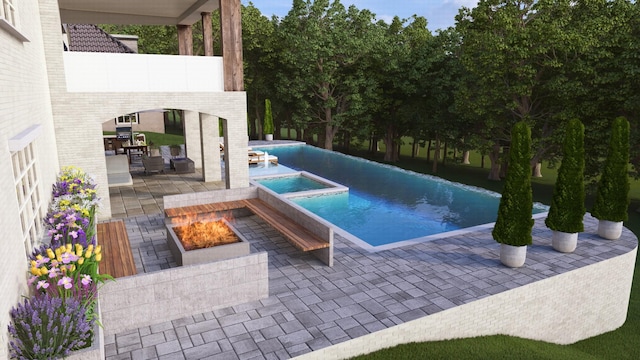 view of swimming pool featuring a fire pit, a patio area, and an in ground hot tub