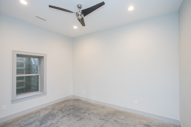 empty room featuring ceiling fan and concrete flooring