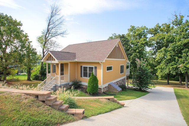 view of front of house featuring a front yard and a porch