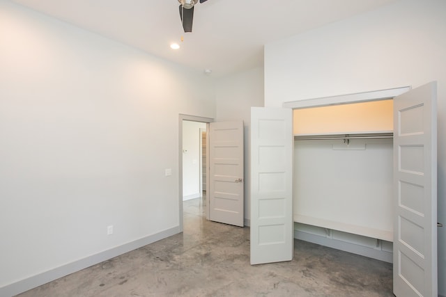 unfurnished bedroom with a closet and ceiling fan