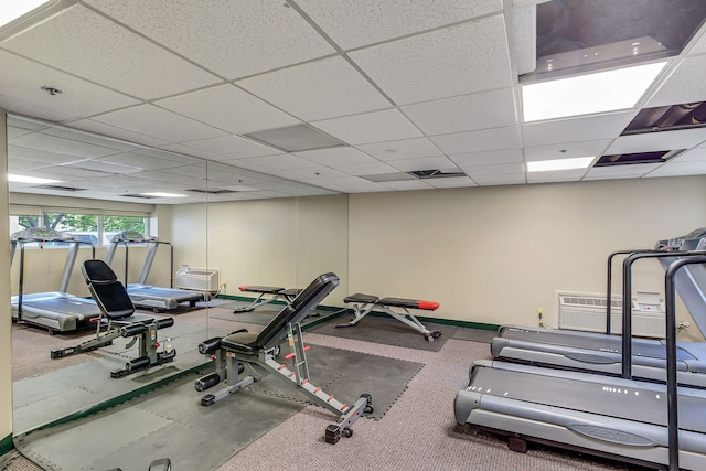 exercise area with a paneled ceiling