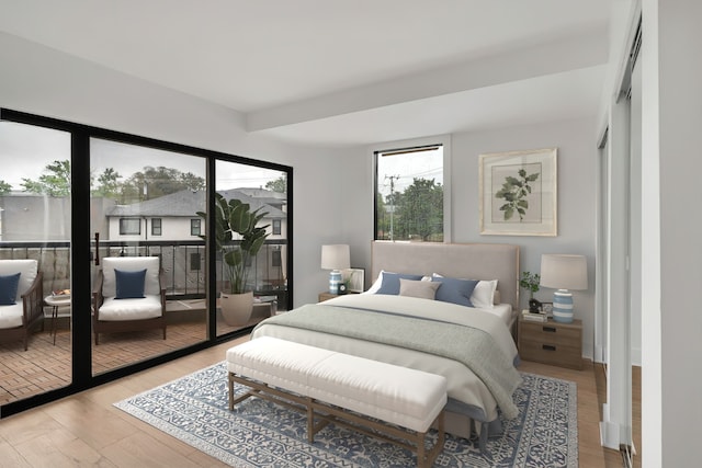 bedroom featuring light wood-type flooring and a closet