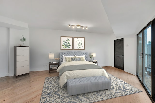 bedroom with light hardwood / wood-style floors