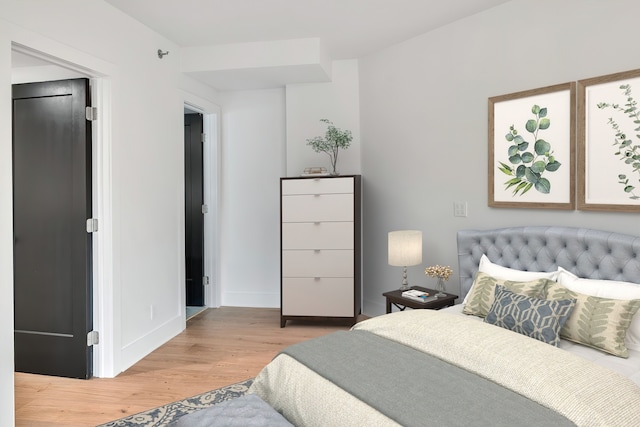 bedroom with light hardwood / wood-style flooring