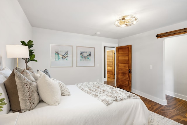 bedroom with dark hardwood / wood-style flooring