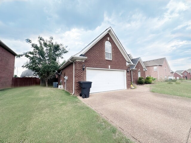 view of property exterior with a garage and a lawn