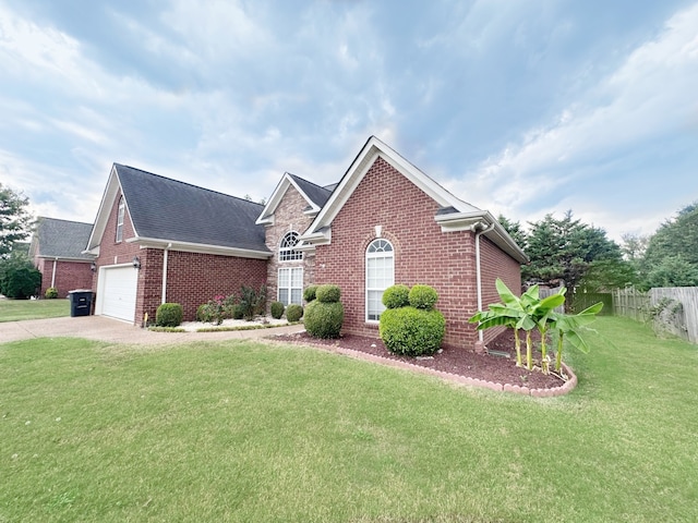 view of front of home with a front yard and a garage