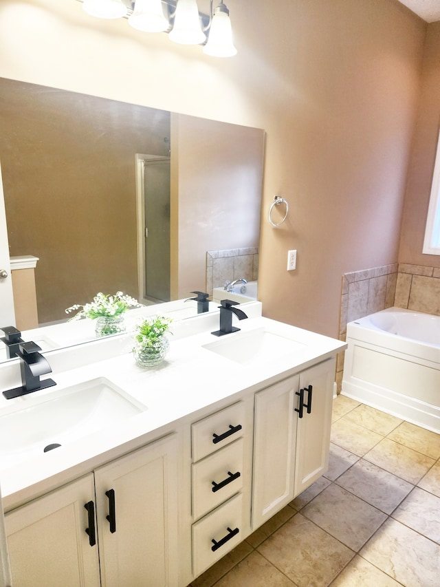 bathroom featuring vanity, tile patterned flooring, and separate shower and tub