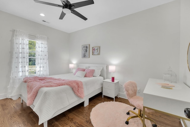 bedroom featuring ceiling fan and dark wood-type flooring