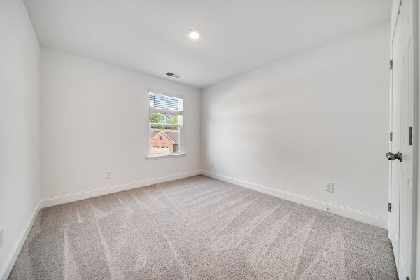 empty room featuring carpet flooring