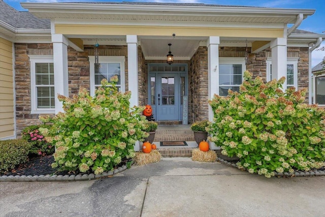 property entrance featuring stone siding