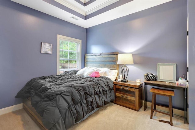 bedroom with carpet flooring, visible vents, crown molding, baseboards, and a raised ceiling