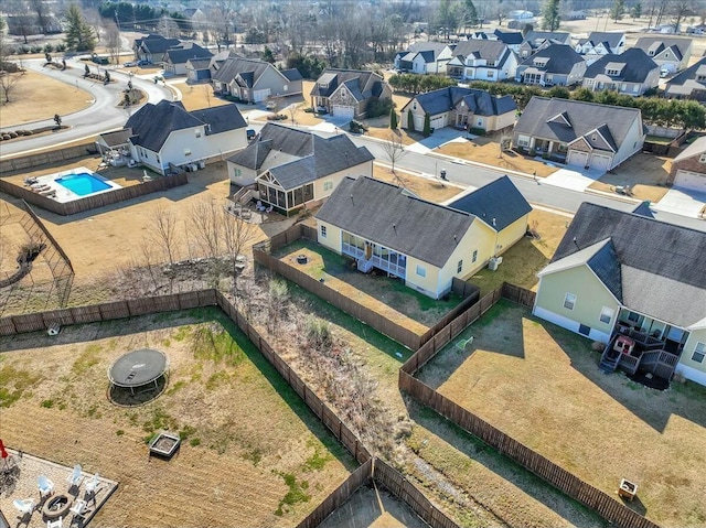 birds eye view of property with a residential view