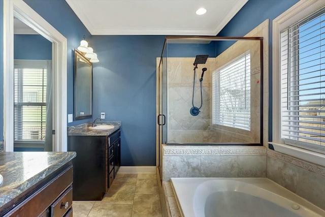 bathroom with a stall shower, crown molding, vanity, a bath, and baseboards