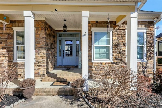 property entrance with stone siding and covered porch