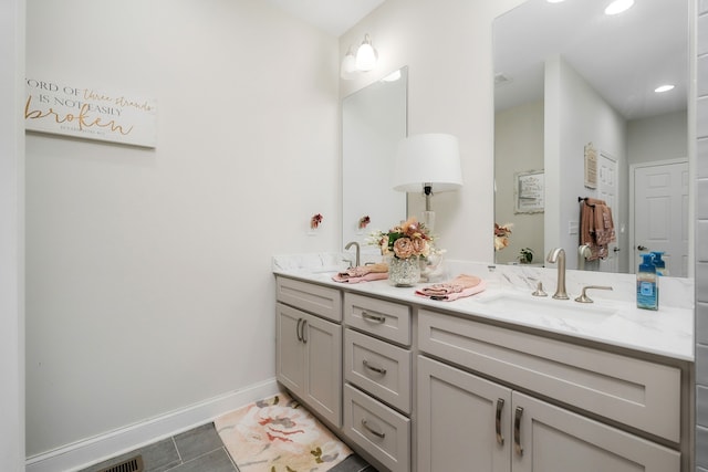 bathroom with tile patterned flooring and vanity