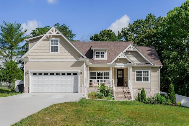 craftsman-style house featuring a porch, a garage, and a front yard