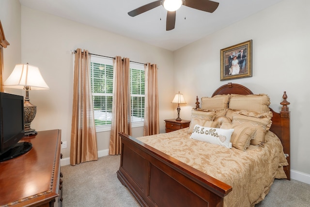 bedroom featuring ceiling fan and light colored carpet