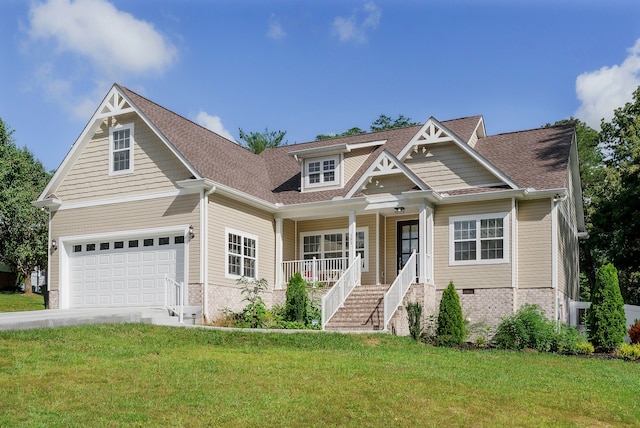 craftsman inspired home featuring a porch, a garage, and a front yard