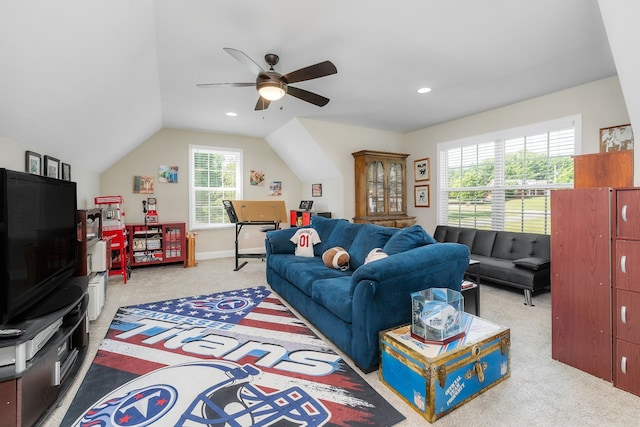 carpeted living room with lofted ceiling and ceiling fan