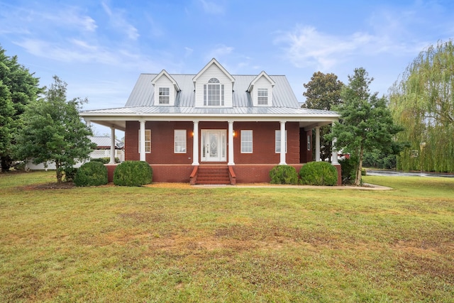 farmhouse inspired home featuring a front lawn and covered porch