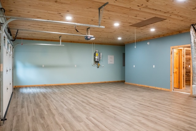 garage featuring a garage door opener, wood ceiling, and water heater