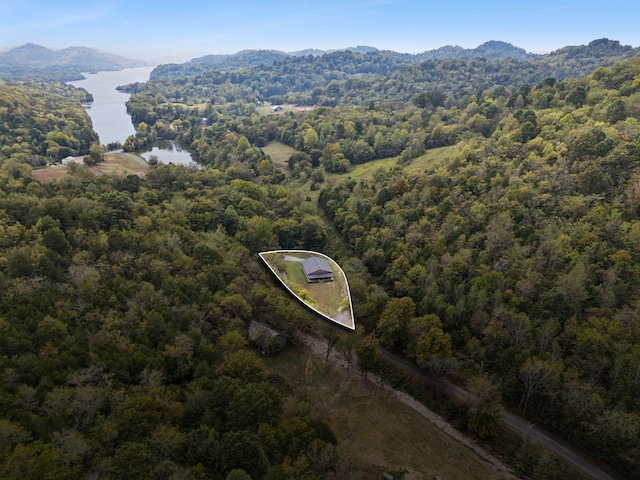 aerial view featuring a water and mountain view