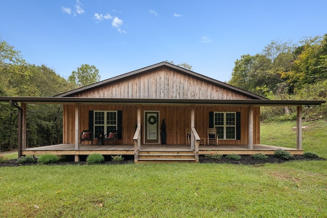 view of front of house featuring a front yard and a porch