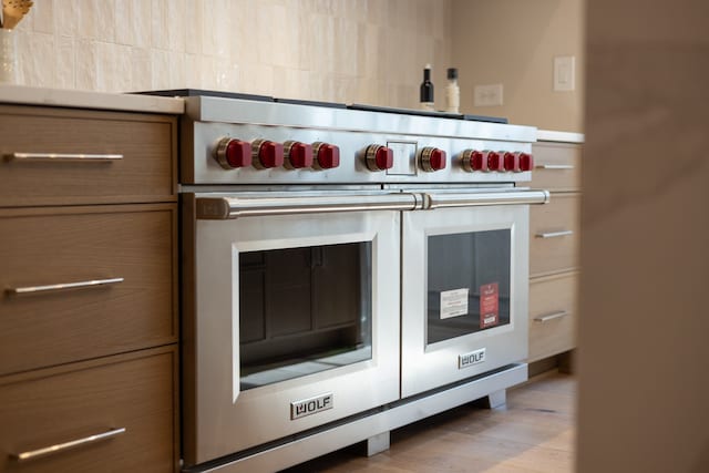 kitchen featuring light hardwood / wood-style floors and premium stove