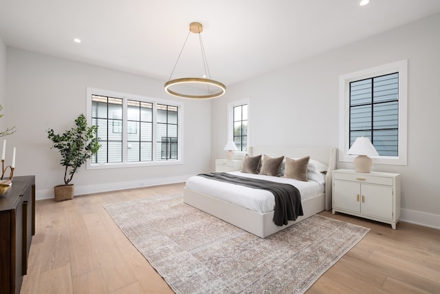 bedroom with light wood-type flooring