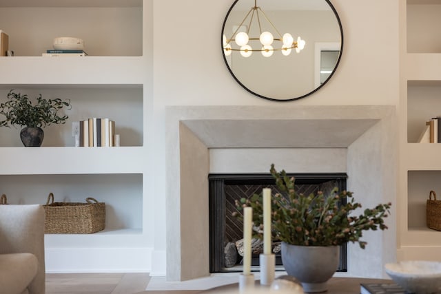 room details with a notable chandelier and built in features