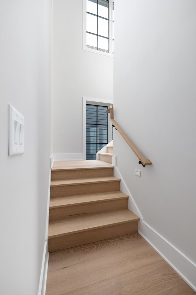 staircase featuring hardwood / wood-style floors