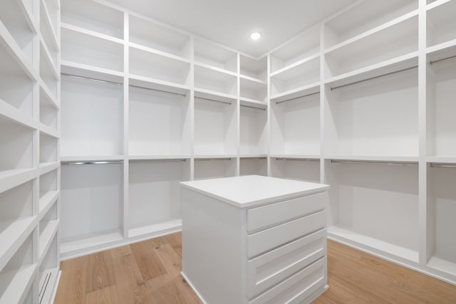 spacious closet featuring light hardwood / wood-style flooring