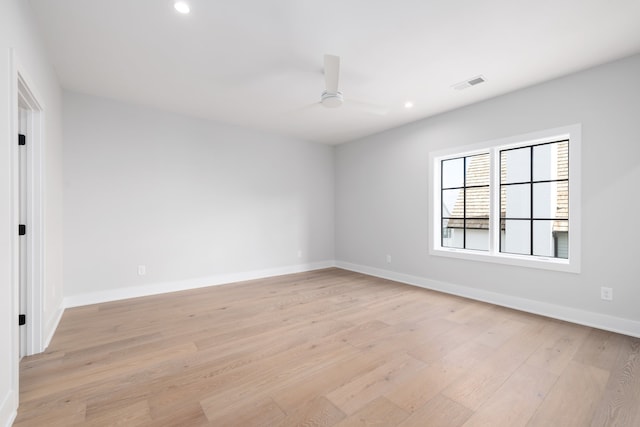 unfurnished room with ceiling fan and light hardwood / wood-style floors