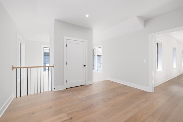 spare room with light hardwood / wood-style flooring