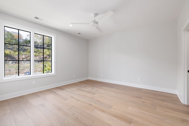 unfurnished room with ceiling fan and light hardwood / wood-style floors