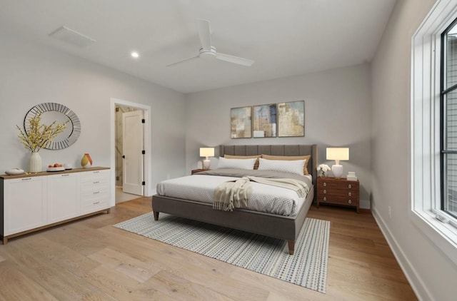 bedroom featuring ceiling fan and light hardwood / wood-style floors