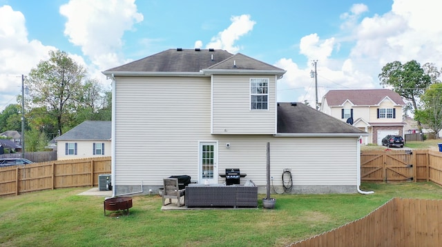 back of property with a patio, an outdoor hangout area, and a yard