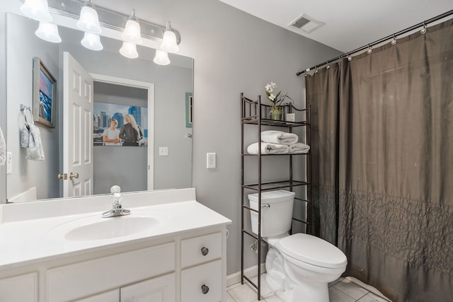 bathroom featuring walk in shower, tile patterned flooring, vanity, and toilet