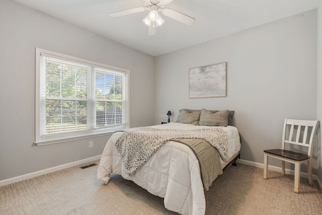 carpeted bedroom with ceiling fan