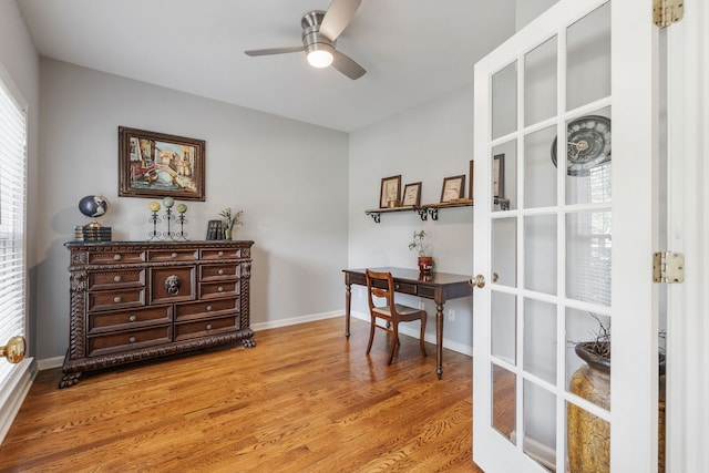 home office with ceiling fan and hardwood / wood-style flooring