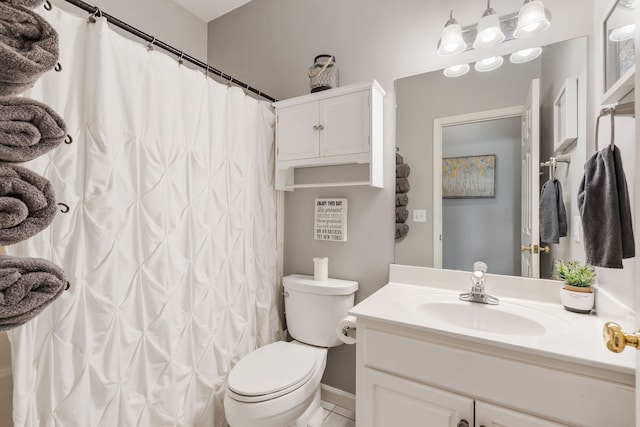 bathroom with tile patterned flooring, vanity, toilet, and a shower with curtain