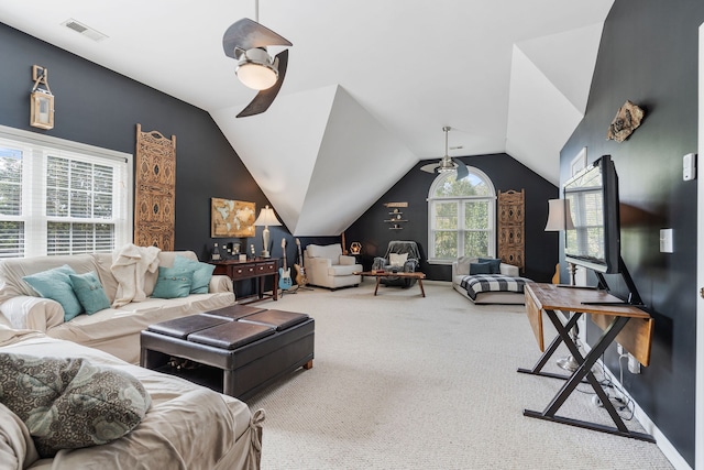 living room with carpet floors, vaulted ceiling, and ceiling fan