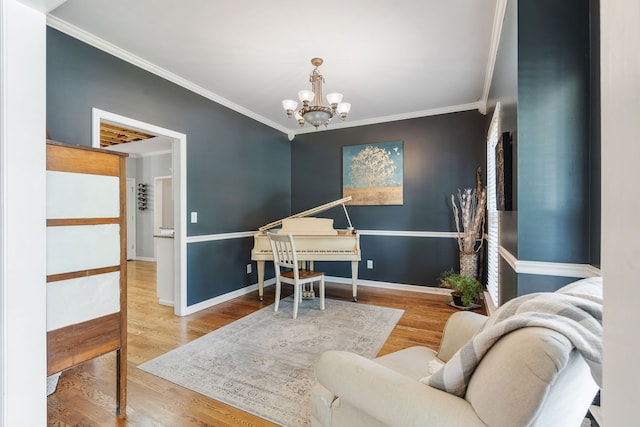 sitting room featuring ornamental molding and hardwood / wood-style floors