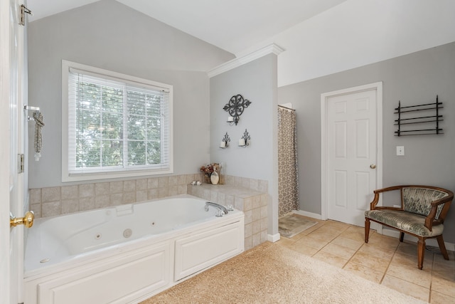 bathroom featuring vaulted ceiling, shower with separate bathtub, tile patterned flooring, and ornamental molding