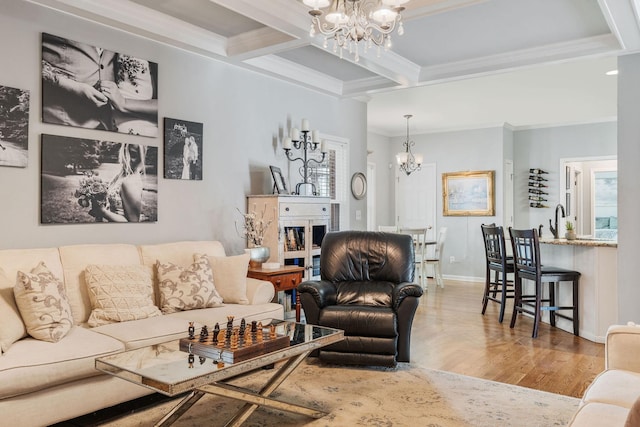 4115 Chancellor Dr, Thompsons Station, TN 37179 - living area with a chandelier, beamed ceiling, ornamental molding, wood finished floors, and coffered ceiling